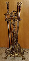antique fireplace tools at auction.